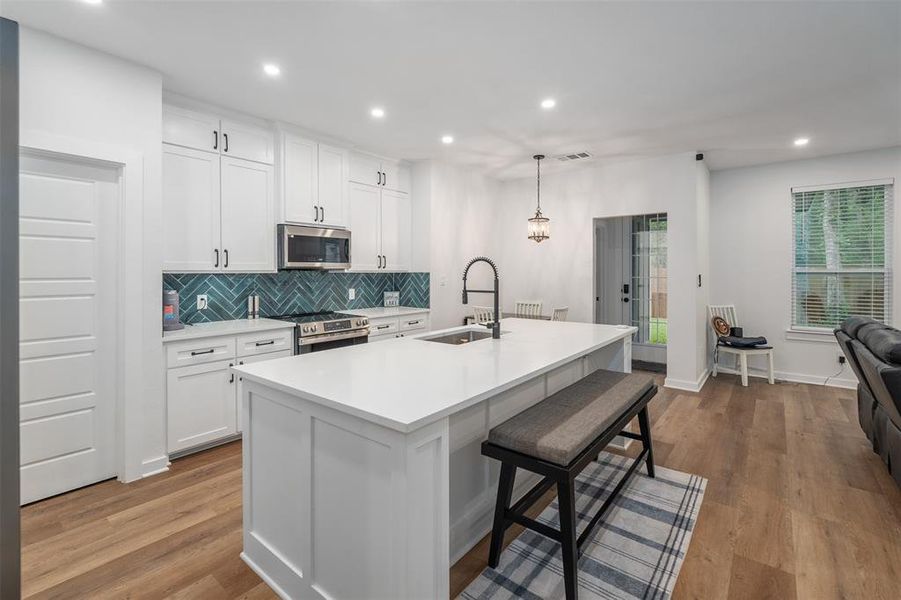 kitchen with walk-in pantry and island kitchen with walk-in pantry and island