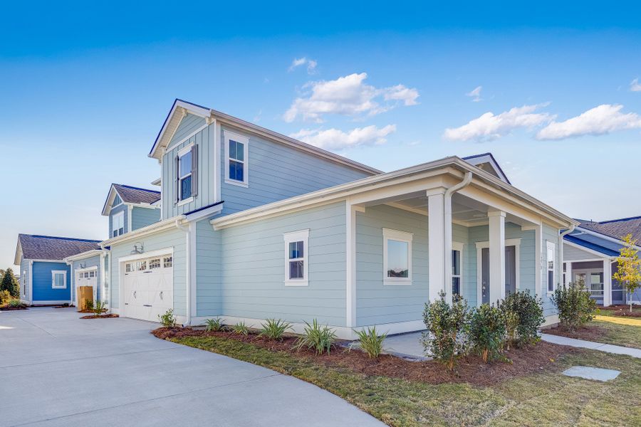 Front exterior of a new home in Horizons at Carnes Crossroads | 55+: Carriage Collection, Summerville, SC, highlighting curb appeal (Image 1). Front exterior of a new home in Horizons at Carnes Crossroads | 55+: Carriage Collection, Summerville, SC, highlighting curb appeal (Image 1).