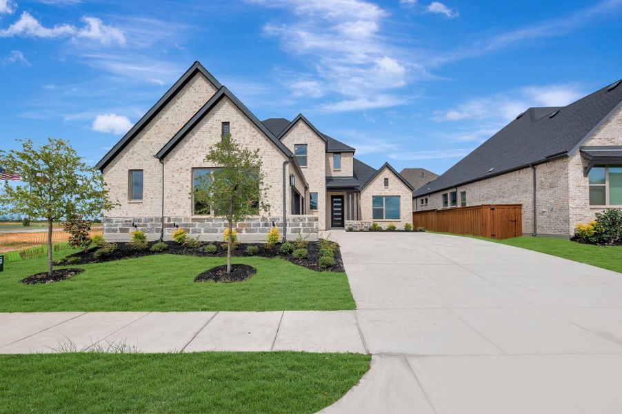 Front exterior of a new home in Terraces – Classics, Rockwall, TX, highlighting curb appeal (Image 1). Front exterior of a new home in Terraces – Classics, Rockwall, TX, highlighting curb appeal (Image 1).
