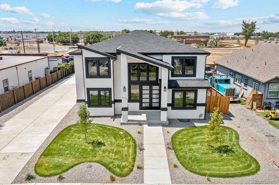 Front exterior of a new home in , Aurora, CO, highlighting curb appeal (Image 24).