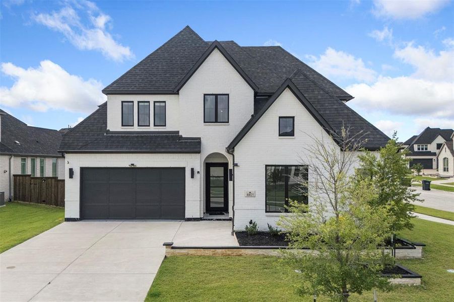 Front exterior of a new home in , Prosper, TX, highlighting curb appeal (Image 2). Front exterior of a new home in , Prosper, TX, highlighting curb appeal (Image 2).