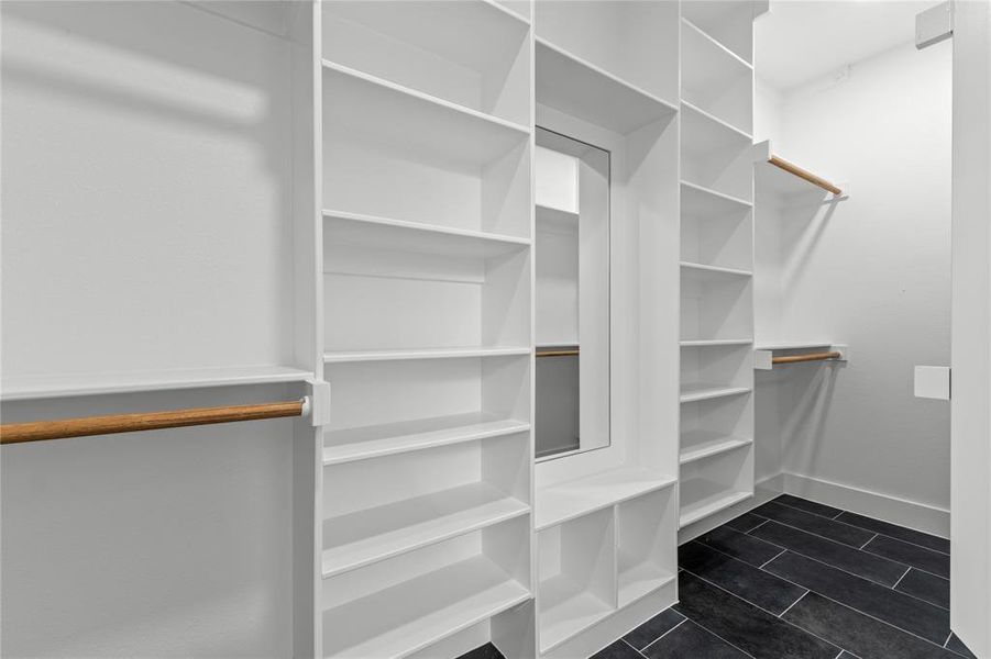 Walk in closet featuring dark tile patterned floors