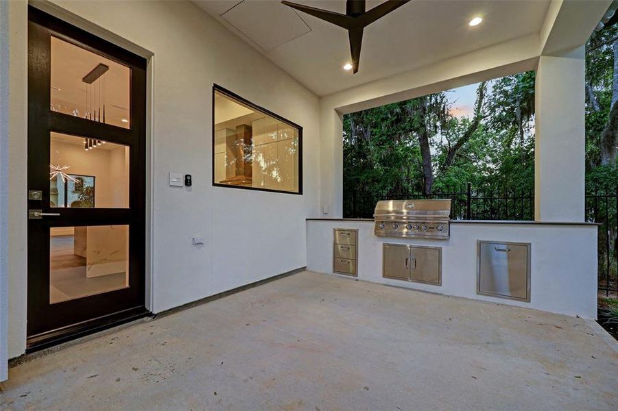 Outdoor covered patio with a built in grilling station.