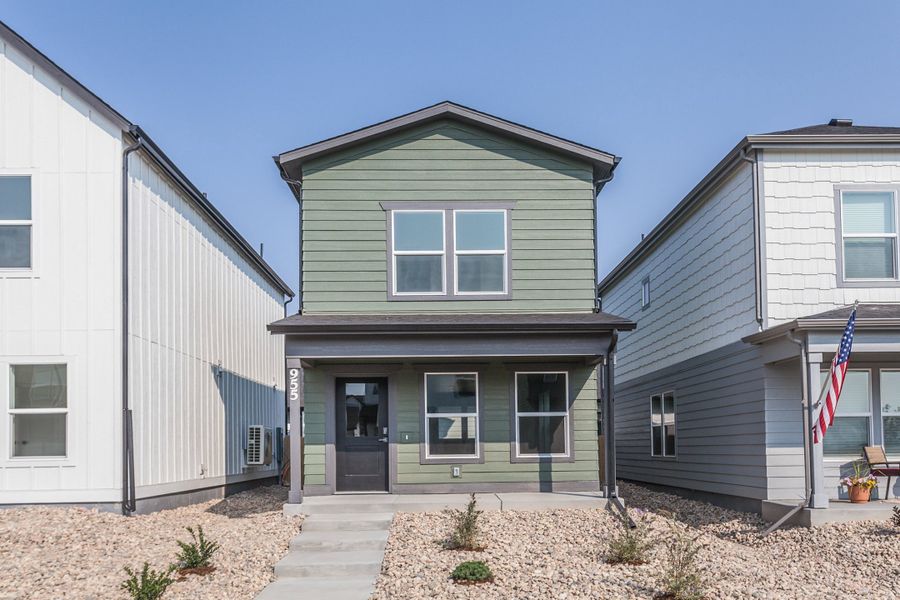 Front exterior of a new home in Prairie Song, Windsor, CO, highlighting curb appeal (Image 1). Front exterior of a new home in Prairie Song, Windsor, CO, highlighting curb appeal (Image 1).