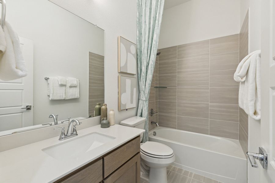 Bathroom in the Gilmour home plan by Trophy Signature Homes – REPRESENTATIVE PHOTO