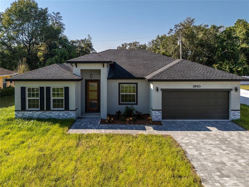 Front exterior of a new home in , Ocala, FL, highlighting curb appeal (Image 23).