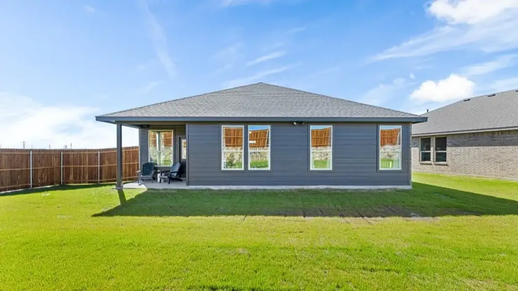 Exterior details and patio area of a home in Bluestem, Rhome (Image 3).