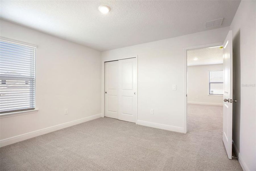 Spacious, unfurnished interior of a new home in The Reserve at Hammock Oaks - Classic Series, Lady Lake (Image 43).