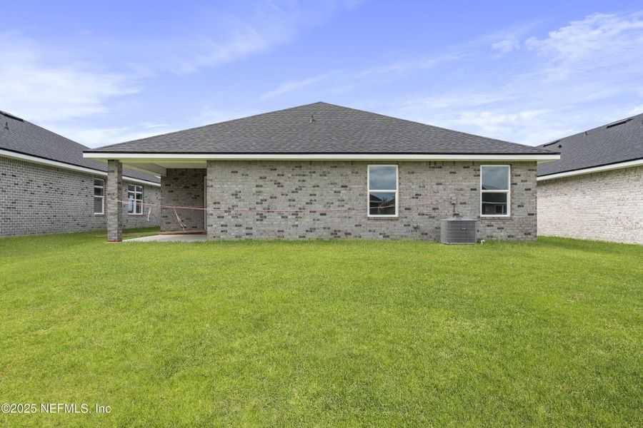 Front exterior of a new home in Shadow Crest at Rolling Hills, Green Cove Springs, FL, highlighting curb appeal (Image 15).
