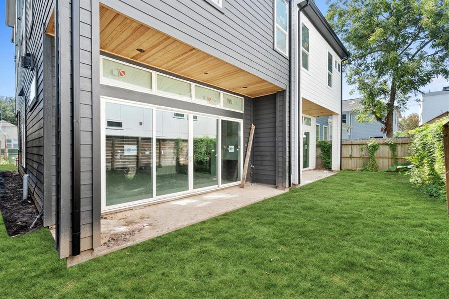 Covered back patio is perfect for relaxation or entertaining.