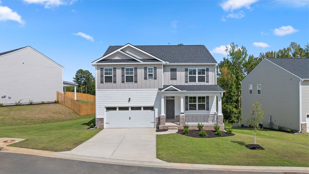 Front exterior of a new home in Southwind Village, Evans, GA, highlighting curb appeal (Image 1). Front exterior of a new home in Southwind Village, Evans, GA, highlighting curb appeal (Image 1).