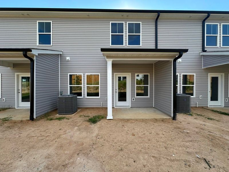 Exterior details and patio area of a home in Windsor Townhomes, North Augusta (Image 3). Exterior details and patio area of a home in Windsor Townhomes, North Augusta (Image 3).