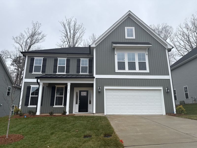 Front exterior of a new home in Hanes Lake, Winston-Salem, NC, highlighting curb appeal (Image 1).