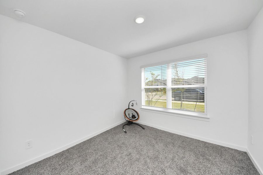 Secondary bedroom is located at the front of the house and could also be used as an office
