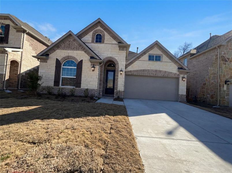Front exterior of a new home in Shaded Tree, McKinney, TX, highlighting curb appeal (Image 17).