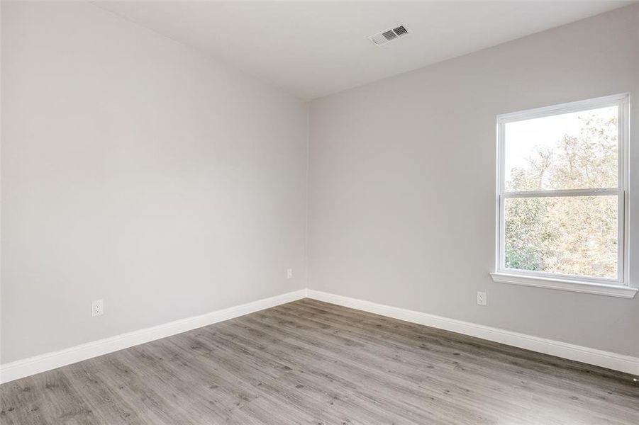 Empty room featuring light hardwood / wood-style floors