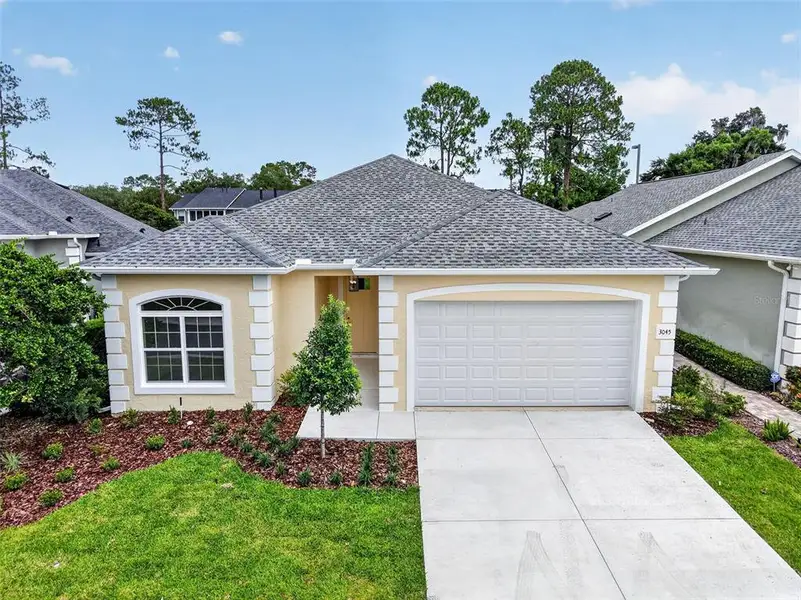 Front exterior of a new home in , Ocala, FL, highlighting curb appeal (Image 2). Front exterior of a new home in , Ocala, FL, highlighting curb appeal (Image 2).