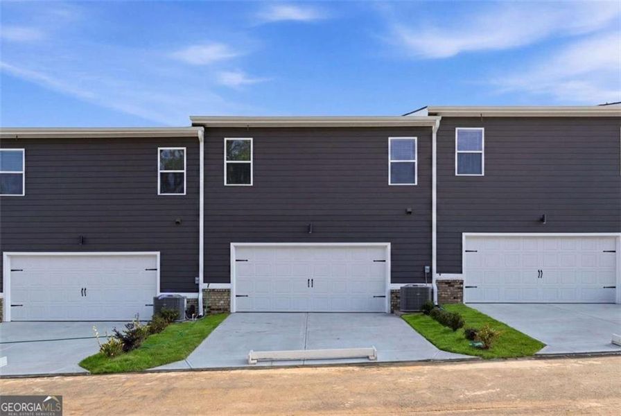 Front exterior of a new home in Parkway James, Snellville, GA, highlighting curb appeal (Image 2). Front exterior of a new home in Parkway James, Snellville, GA, highlighting curb appeal (Image 2).