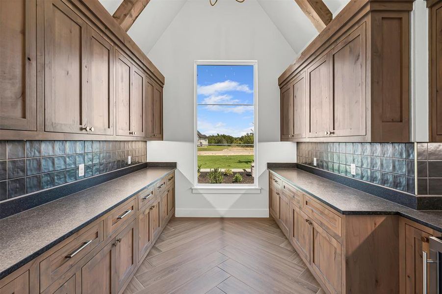 Laundry room with a chandelier and wine cooler Laundry room with a chandelier and wine cooler