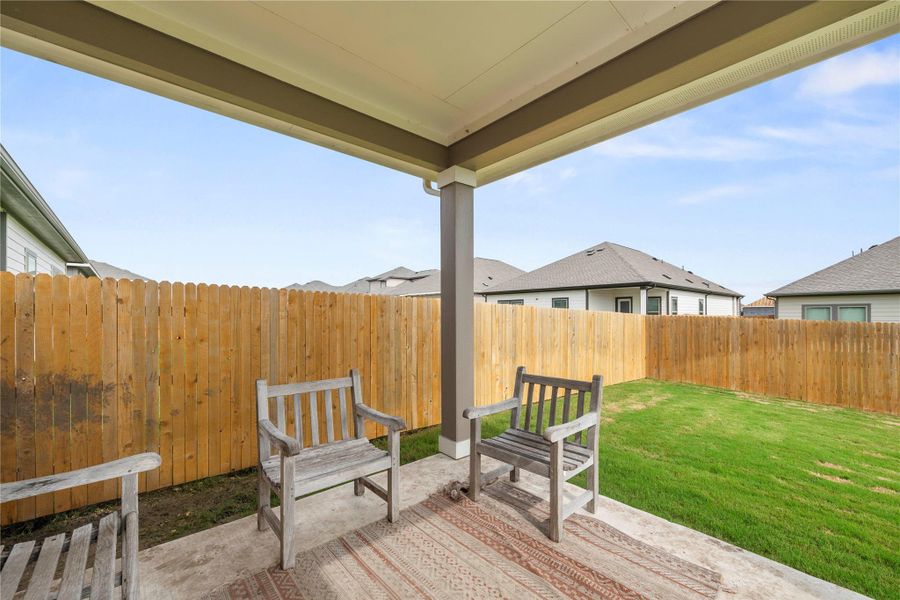 Unwind outdoors on the private covered patio overlooking the fully fenced backyard. Unwind outdoors on the private covered patio overlooking the fully fenced backyard.