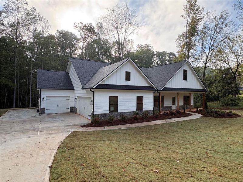 Front exterior of a new home in , Dallas, GA, highlighting curb appeal (Image 25).