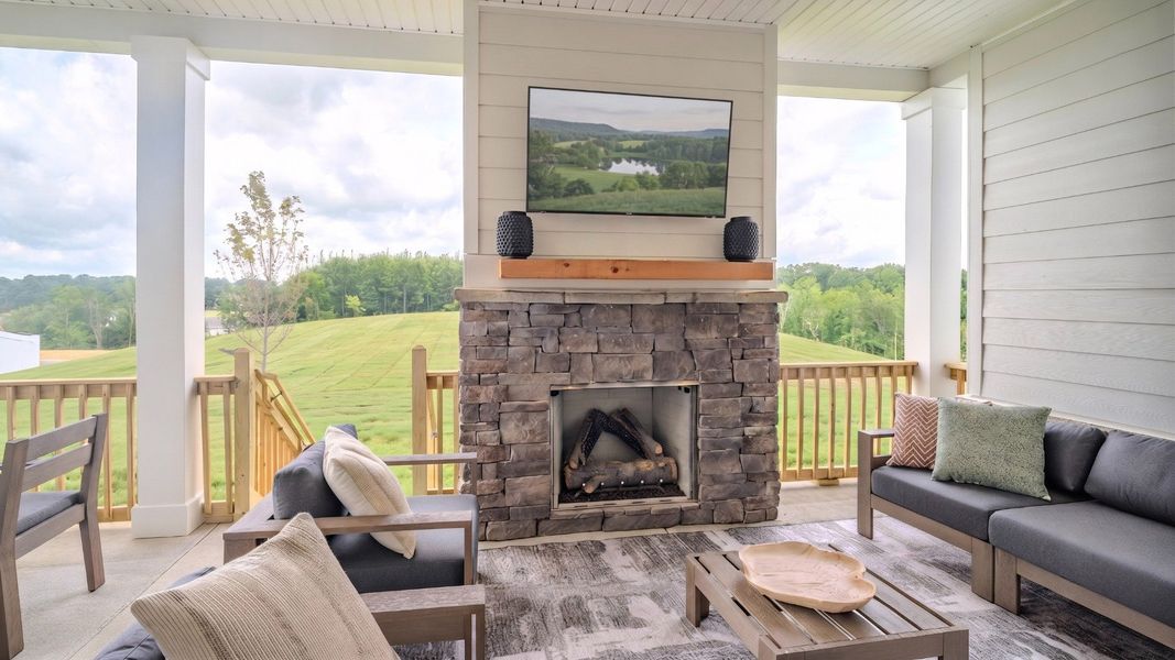Spacious rear covered patio with fireplace Spacious rear covered patio with fireplace