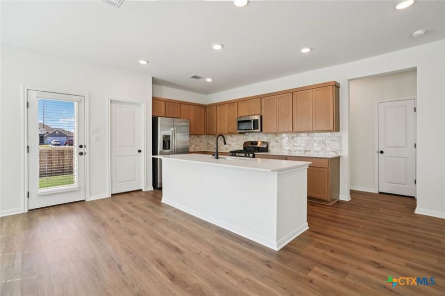 Furnished interior view inside a new home in Village at Three Oaks, Seguin (Image 8).