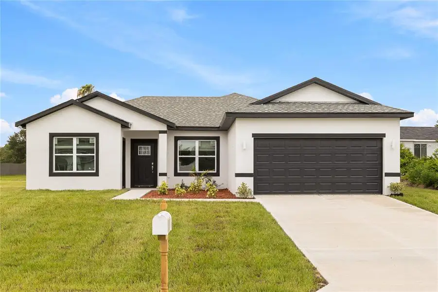 Front exterior of a new home in , Ocala, FL, highlighting curb appeal (Image 1). Front exterior of a new home in , Ocala, FL, highlighting curb appeal (Image 1).