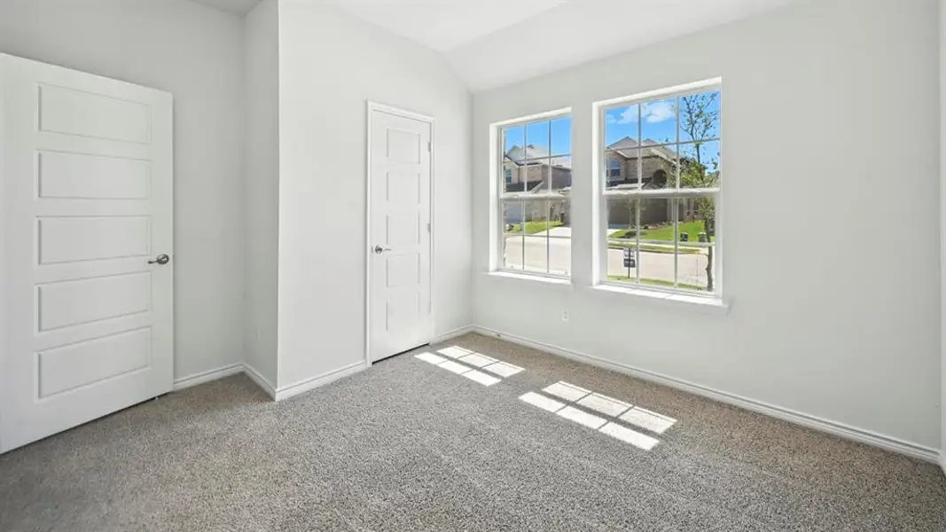 Room with light gray carpet flooring and white walls Room with light gray carpet flooring and white walls