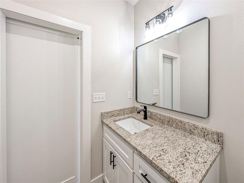 Bathroom featuring vanity Bathroom featuring vanity