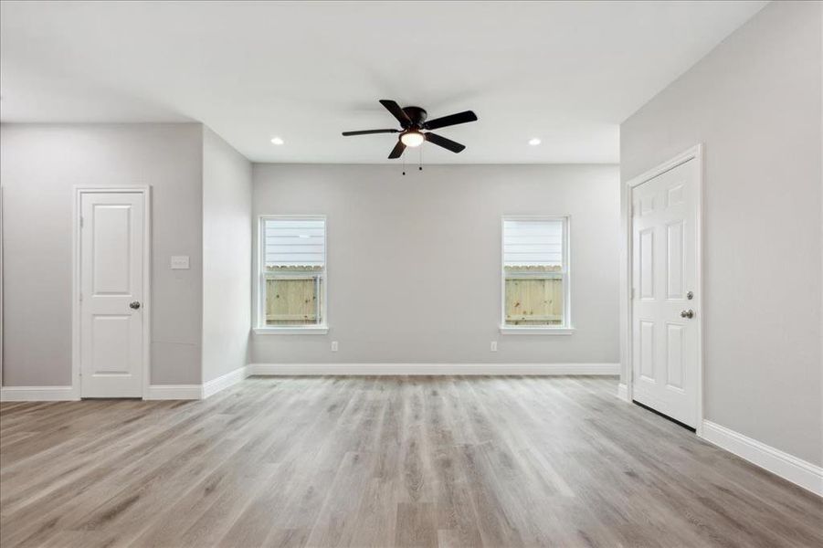 Unfurnished room featuring light hardwood / wood-style flooring and ceiling fan