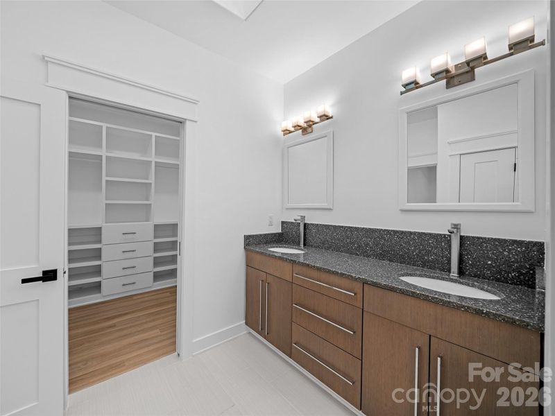 Double vanity in main bath with walk in closet