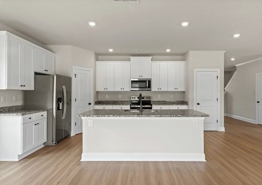 The kitchen island has lots of space for meal prep