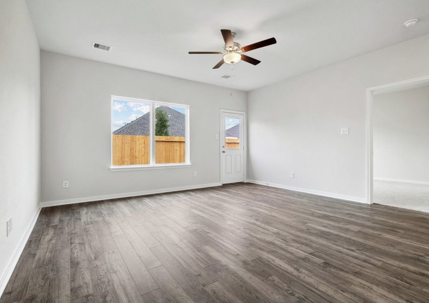 Family room with vinyl flooring and a ceiling fan Family room with vinyl flooring and a ceiling fan