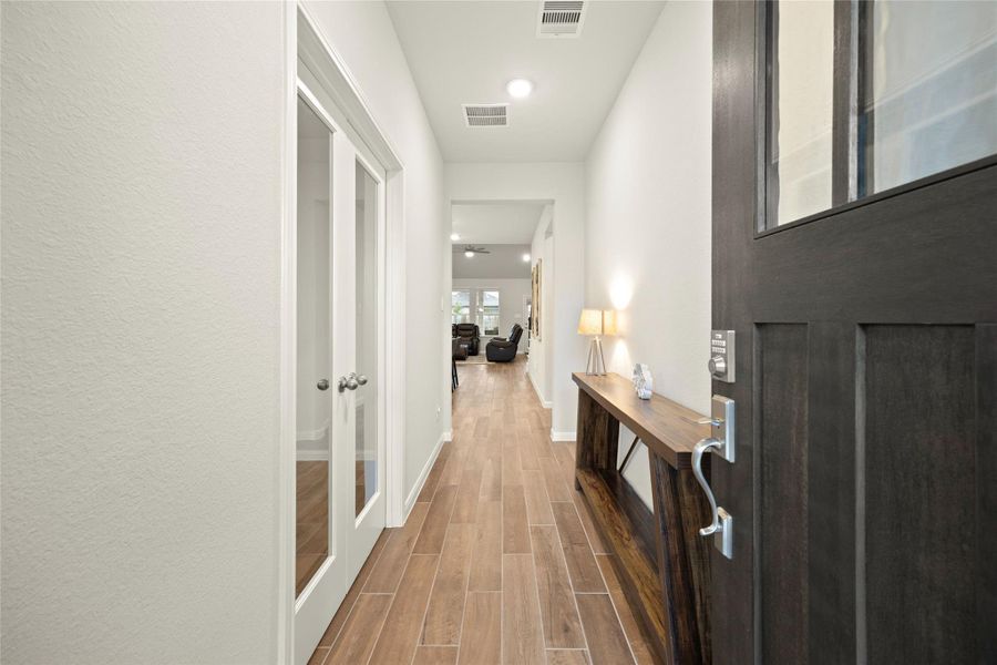 Step inside through the beautiful glass-paneled wood front door and into a bright, welcoming foyer. Step inside through the beautiful glass-paneled wood front door and into a bright, welcoming foyer.