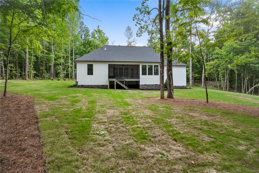 A well-maintained lawn offers ample space, complem A well-maintained lawn offers ample space, complem