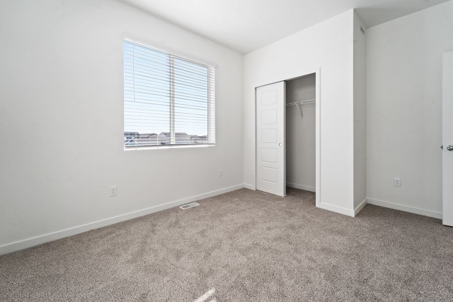 Representative exterior photo of a completed home built from the Telluride by Baessler Homes in Liberty Draw, Evans, CO (Image 33).