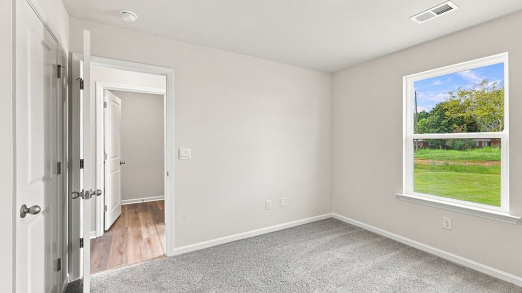 Spacious, unfurnished interior of a new home in Village 3, Woodruff (Image 27).