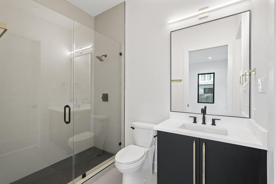 The shower Bath has the same high end appointments seen in all five bathrooms.