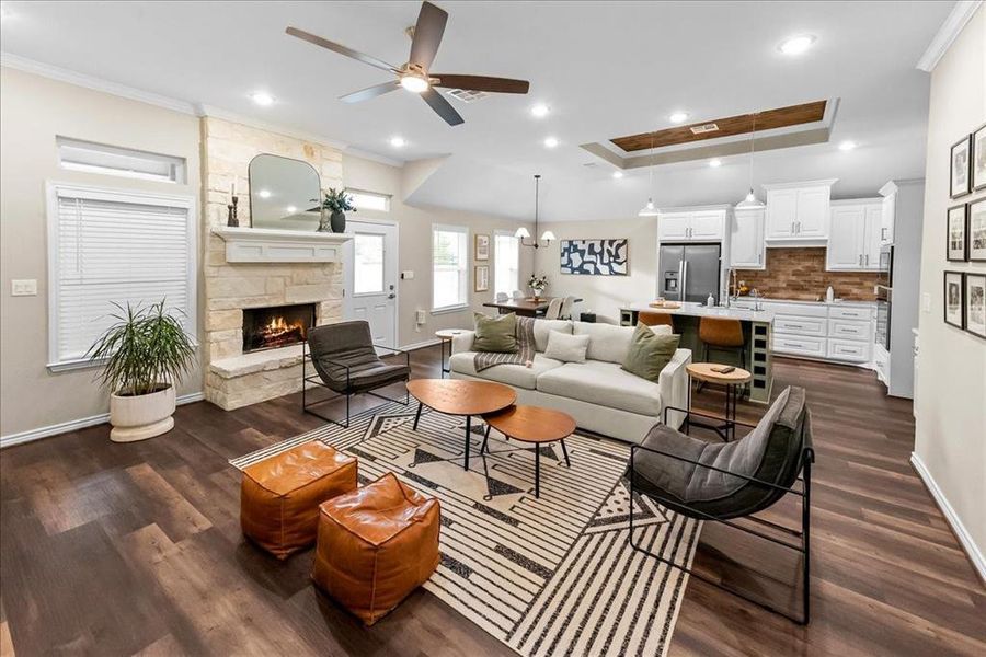 Living area featuring a stone fireplace