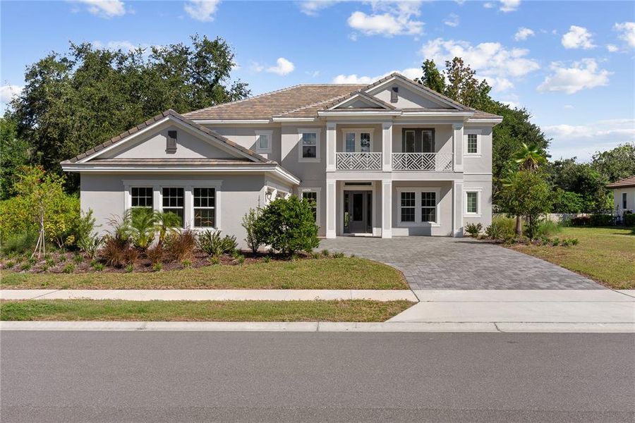 Front exterior of a new home in Fire Creek, Gotha, FL, highlighting curb appeal (Image 28). Front exterior of a new home in Fire Creek, Gotha, FL, highlighting curb appeal (Image 28).