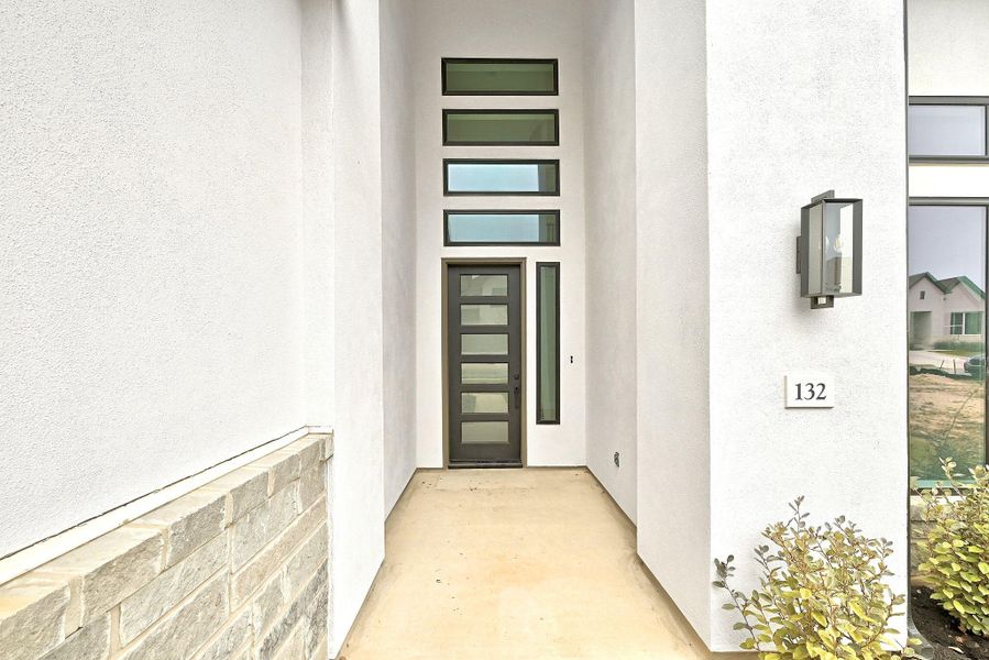Exterior details and patio area of a home in The Colony, Bastrop (Image 4).