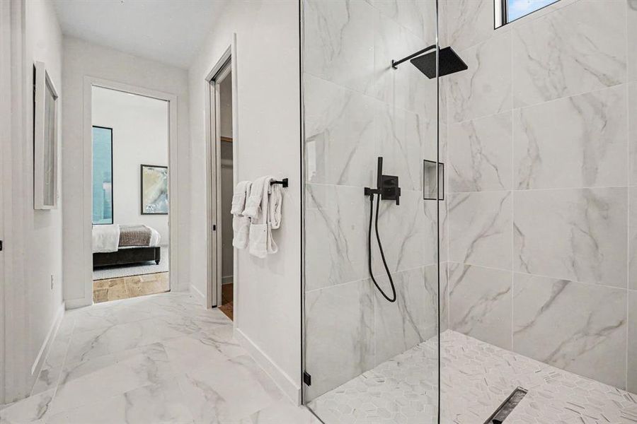 Hotel vibes in the luxurious ensuite with a combination wet-room and large walk-in closet.