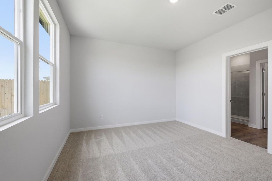 Spacious, unfurnished interior of a new home in Stallion Run, Buda (Image 38).