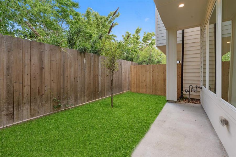 Step outside to the covered patio area and enjoy this inviting outdoor space.