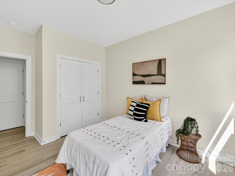 Cozy secondary bedroom filled with natural light, featuring neutral tones and a flexible layout ideal for guests, a home office, or additional living space. Cozy secondary bedroom filled with natural light, featuring neutral tones and a flexible layout ideal for guests, a home office, or additional living space.