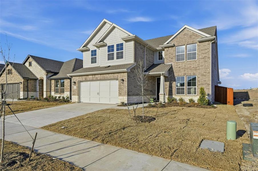Front exterior of a new home in Morningstar, Aledo, TX, highlighting curb appeal (Image 24). Front exterior of a new home in Morningstar, Aledo, TX, highlighting curb appeal (Image 24).