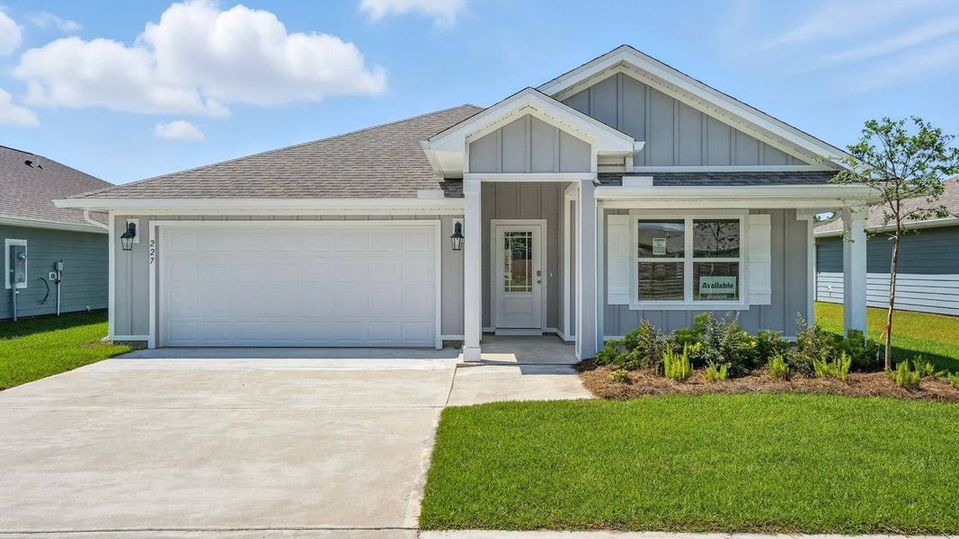 Front exterior of a new home in Palmetto Bluff, Port Saint Joe, FL, highlighting curb appeal (Image 1).
