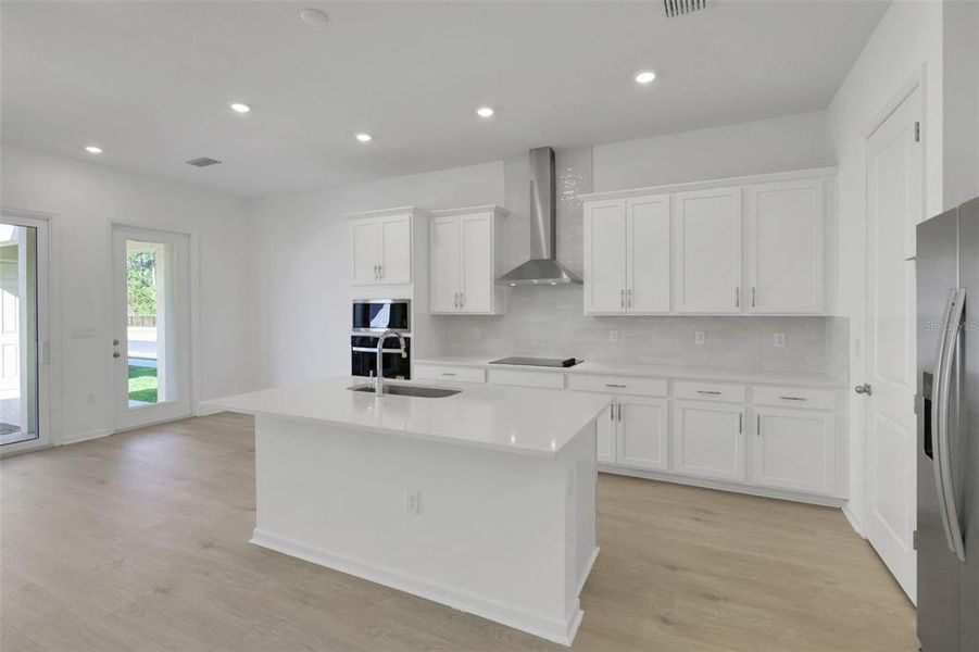 Furnished interior view inside a new home in Serenade at Ovation, Winter Garden (Image 16).