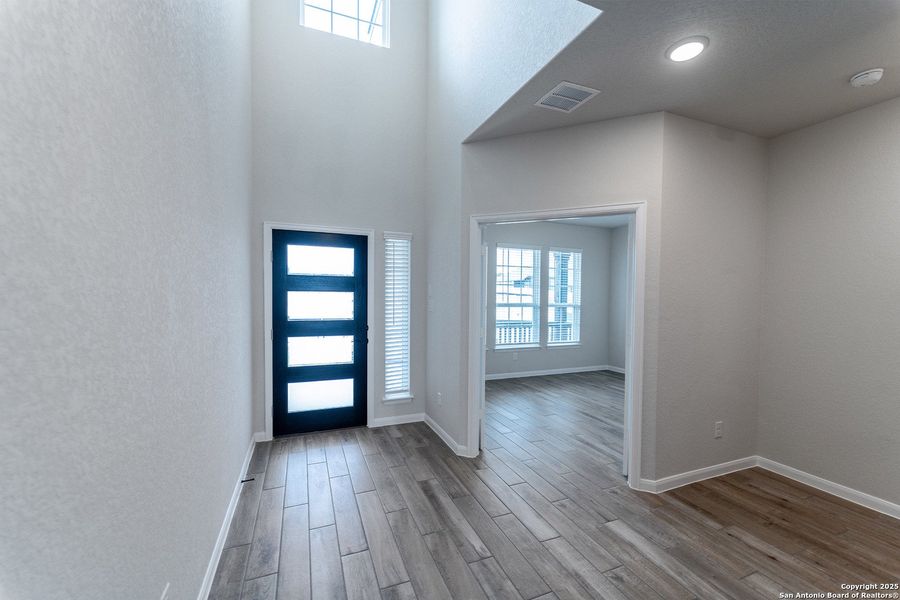 Spacious, unfurnished interior of a new home in The Woodlands at Medina Hills, Mico (Image 21).
